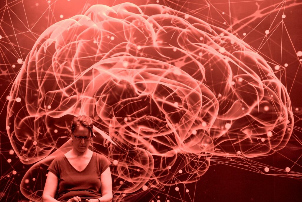 Illustration of a brain made of glowing red neural connections
