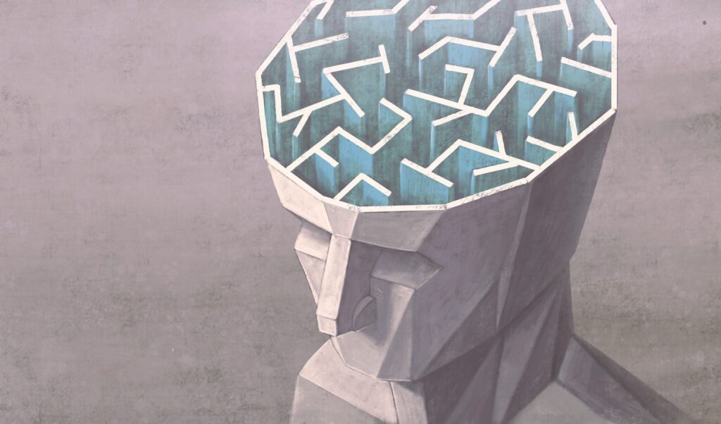 A sculpted head with a maze in place of the brain